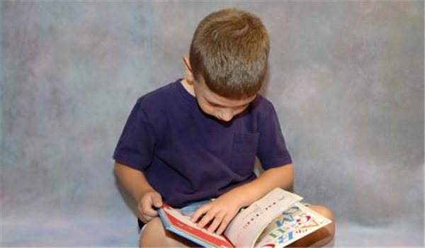 A boy reading a book