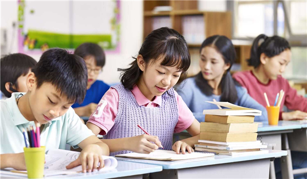 Kids writing in class room