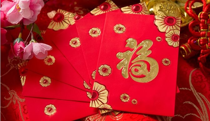 Giving red envelops or Hongbao is a custom at Chinese New Year. 