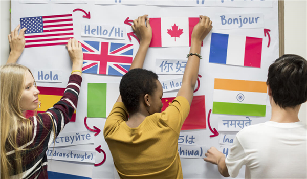 Three students standing in front of a whitboard 